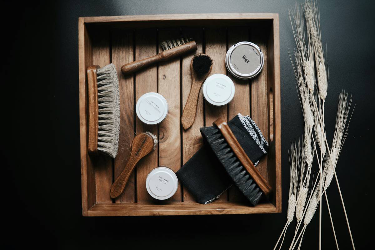 A beautifully arranged premium beard grooming kit on a wooden table