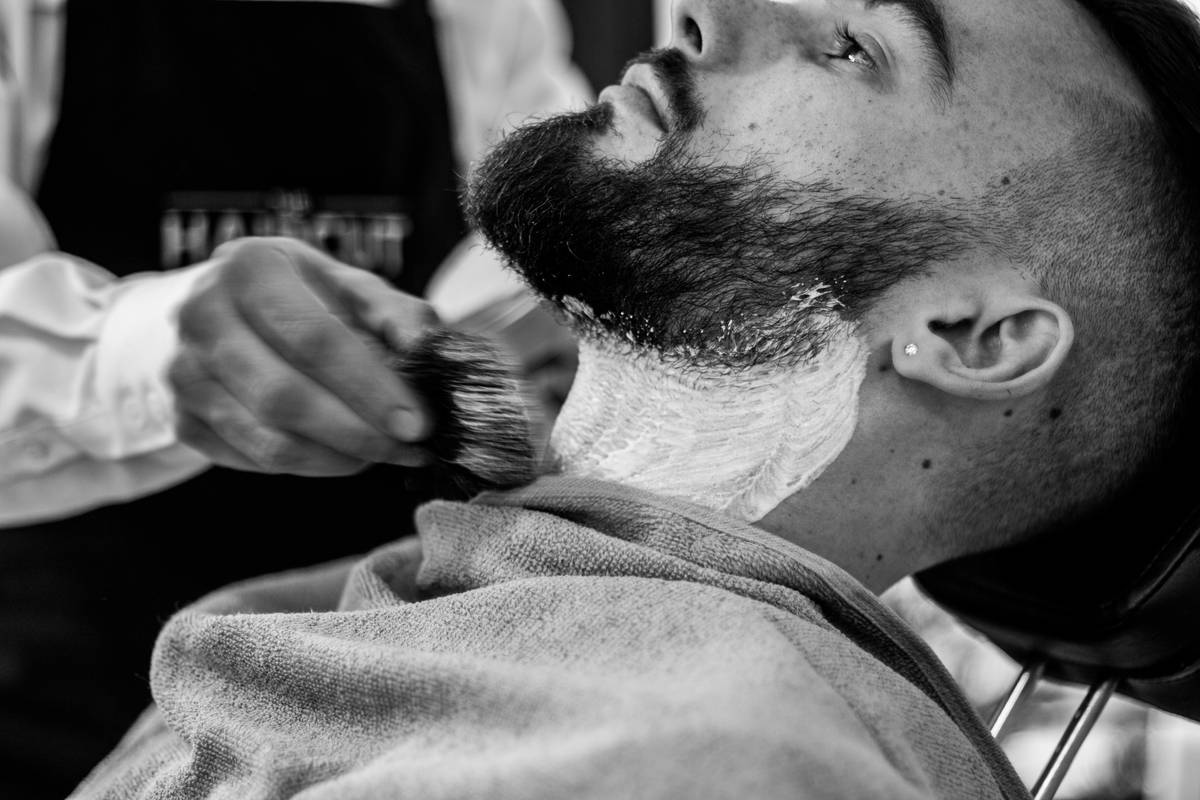 An artisan-style DIY beard grooming kit complete with natural ingredients and tools.