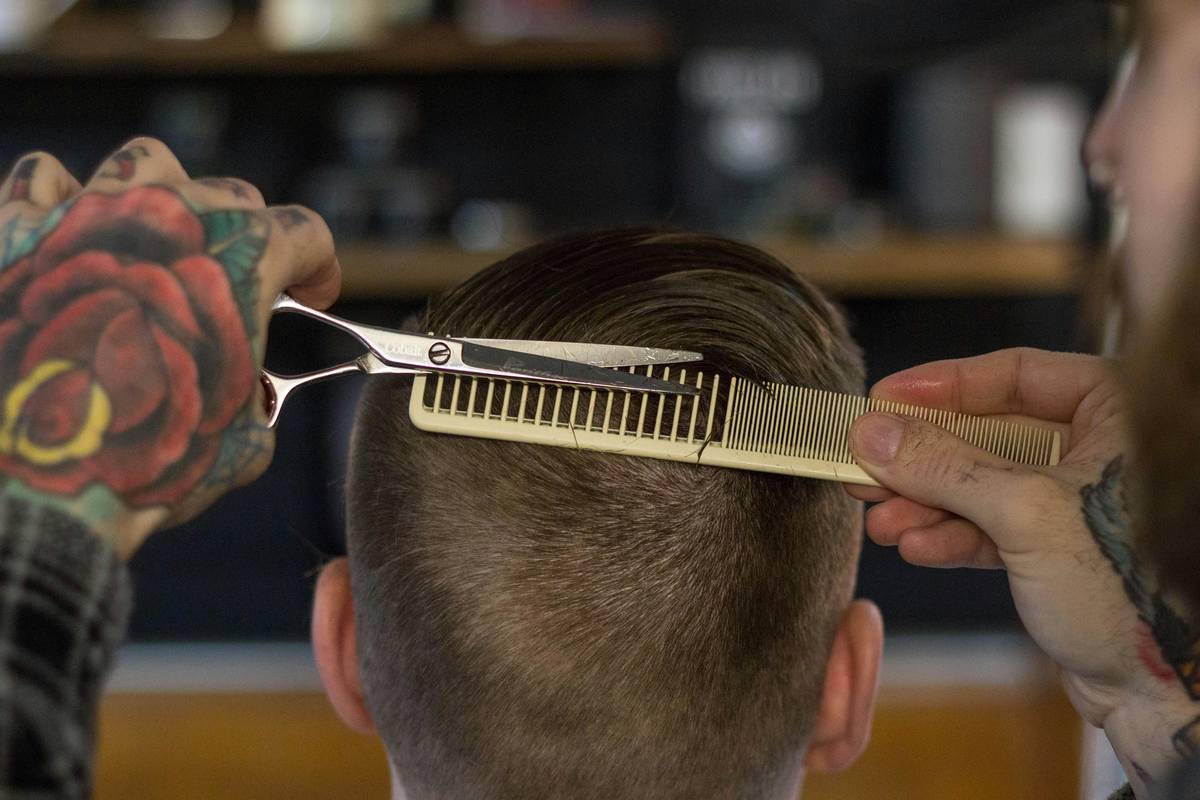 Luxury beard grooming kit displayed elegantly on marble surface with rustic theme.
