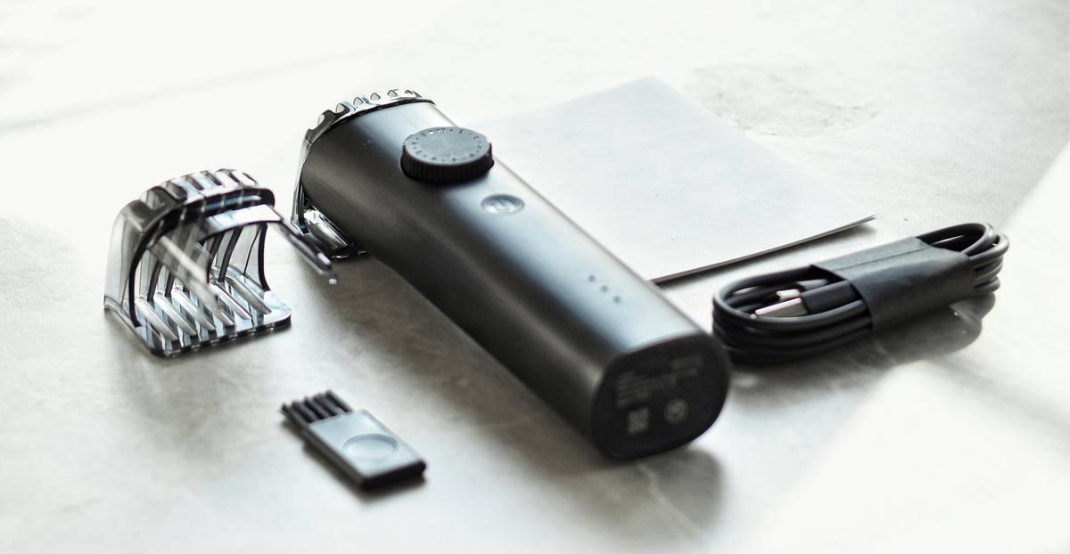 Man posing confidently outdoors with well-groomed beard