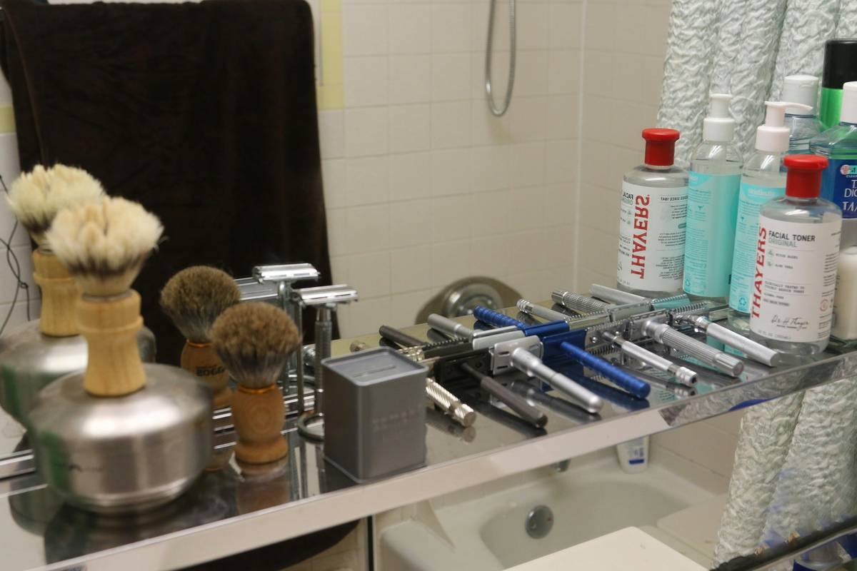A high-quality image showcasing various beard care and grooming kit essentials like oils, balms, brushes, and trimmers.
